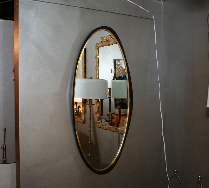 Pair of Walnut Oval Mirrors with Brass Bands by Harvey Probber