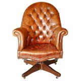 English leather desk chair with revolving mechanism.