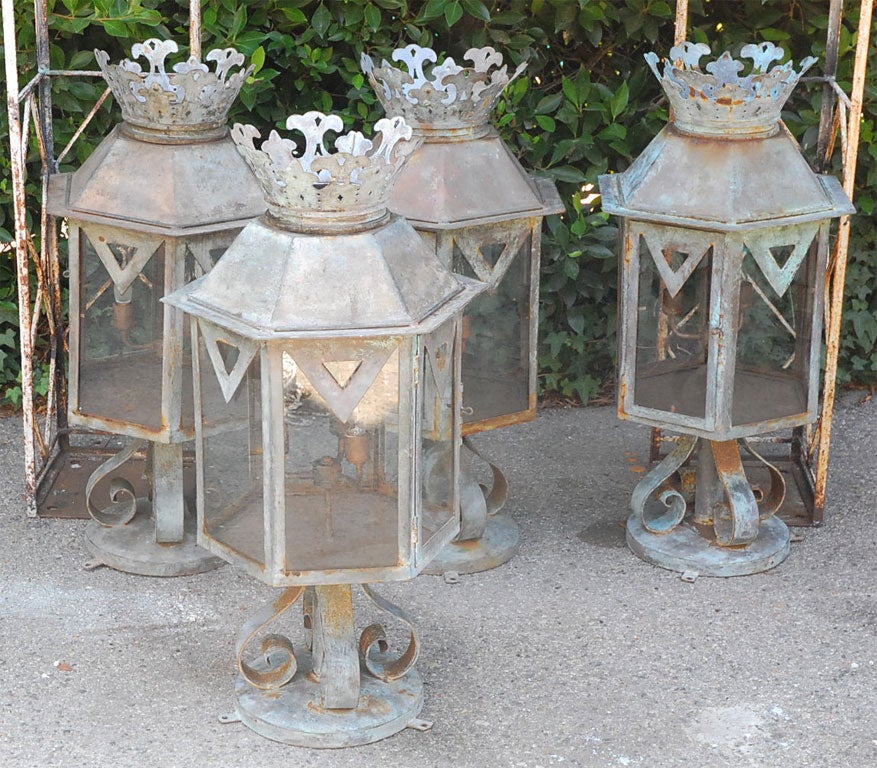 Pair of large outdoor column lanterns from Ramona House in the Pacific Palisades. Original from the 1920's when the house was built. Hand wrought steel and hand cut crown trim pieces. Original finish and patination. Previously mounted on gate