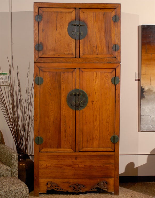 Compound cabinets in this style are rare today.  This is a completely authentic cabinet with original hardware.  The top is removable.  Notice the detailed carving on the base of the piece.