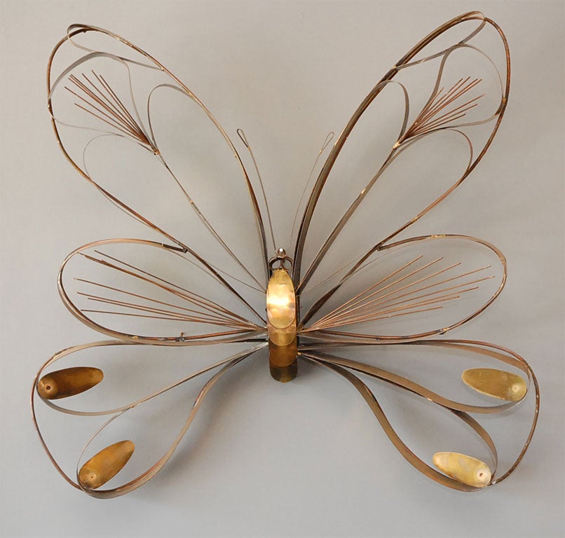 This gorgeous brass butterfly is signed by C Jere.