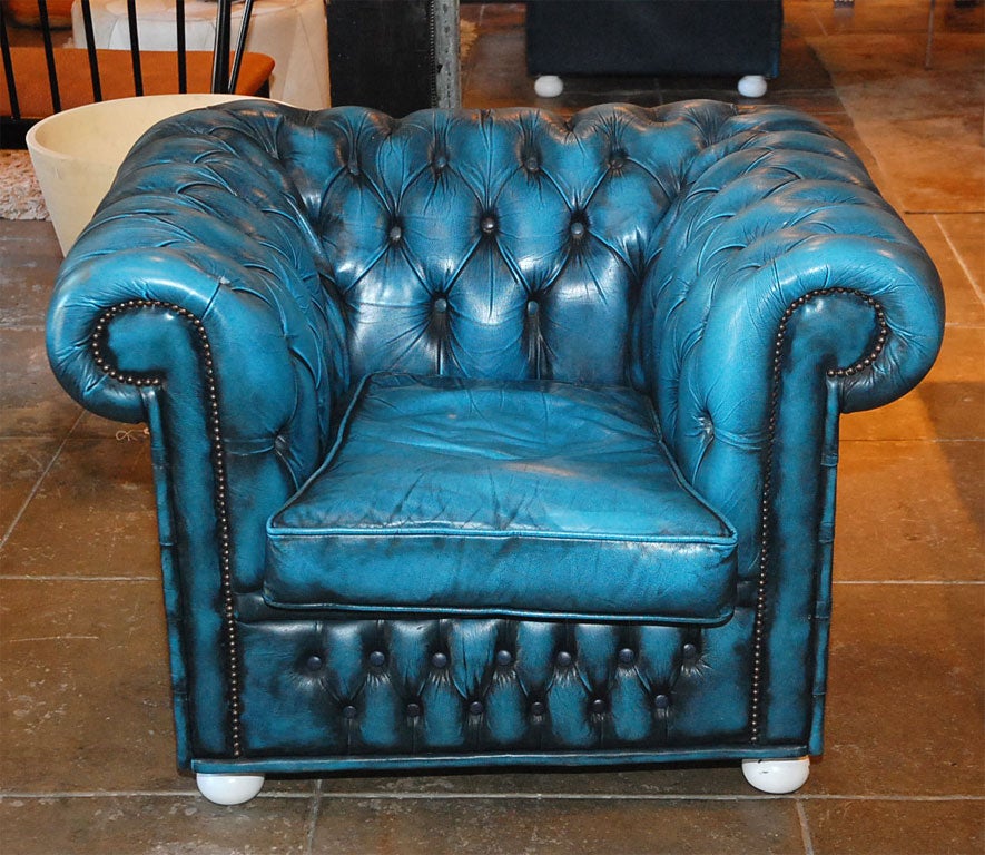 Great pair of vintage blue leather Chesterfield chairs.<br />
Nice lines. Incredible patina and color. Legs have been lacquered off-white.<br />
See other listing for matching sofa.