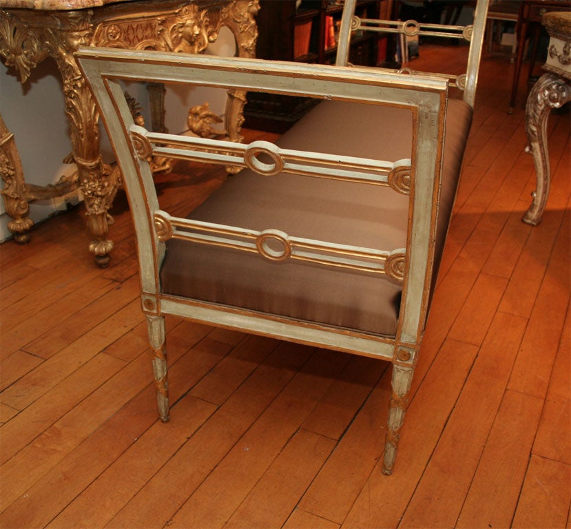 An Empire Painted and Parcel Gilt Bench