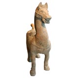 A Han Dynasty Terra Cotta Figure of a Prancing Horse