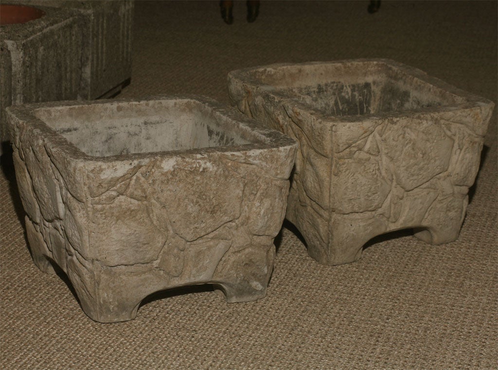 square cement molded urns with rock motif