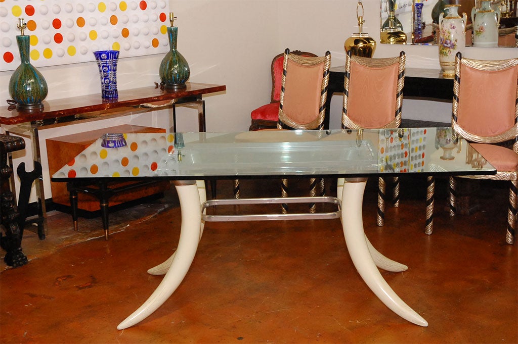 Stunning faux tusk dining table with glass top. By Suzanne Dahl and Jerry Barich