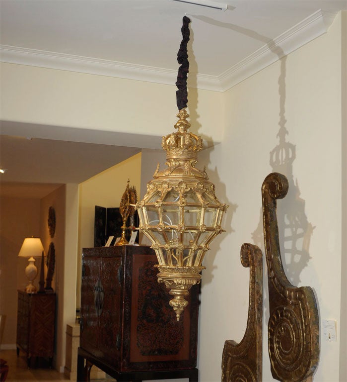 20th century delicately and finely crafted handcarved italian giltwood classic form lantern the whole with beveled armature joined by fluerettes the base with stylized finial covered in acanthus leaves the top each panel cresting in shell motif the