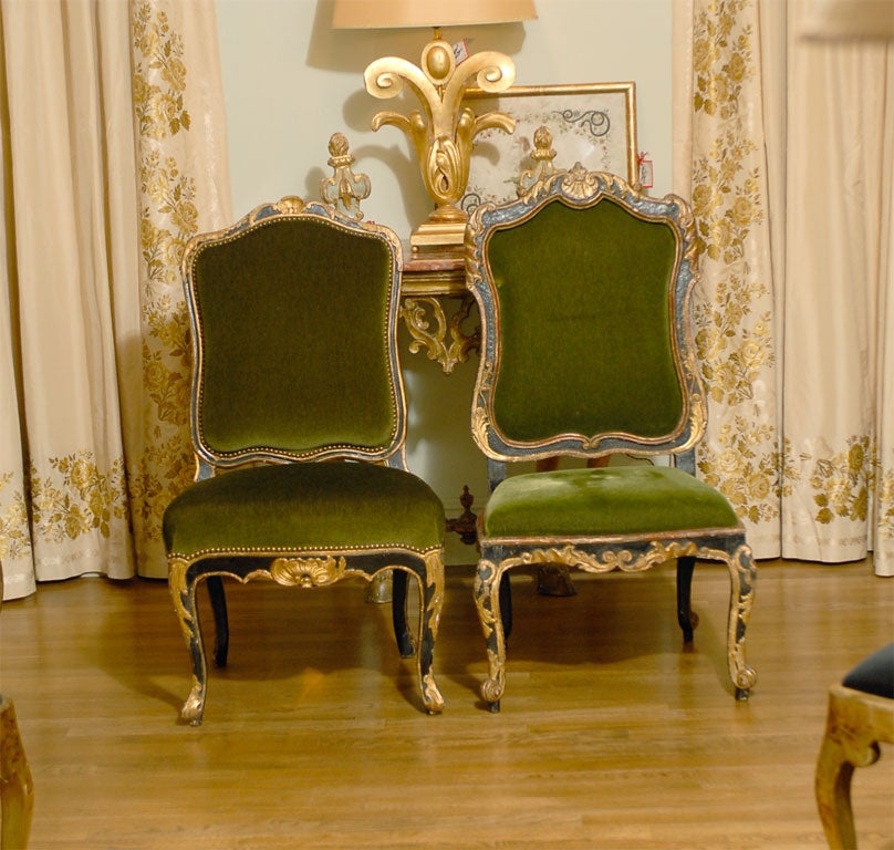 Set of 4 Italian Rococo side chairs gilded and carved with a shell motif, the legs are cabriole and are enriched with carving, terminating at the foot with a small scroll. The 2 additional matching Italian side chairs have an upholstered back. All