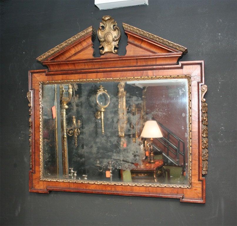 Fine George II walnut and gilt overmantel pediment mirror with cartouche surmount.