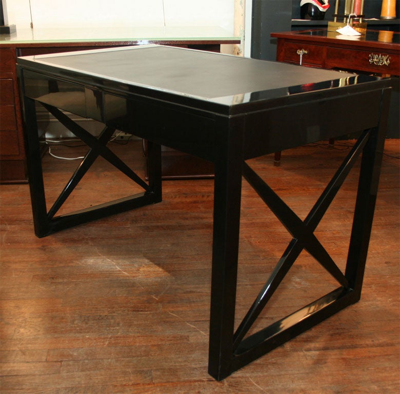 A very interesting two drawer writing table, black lacquered, att. to Andre DEVECHE, French, circa 1940.