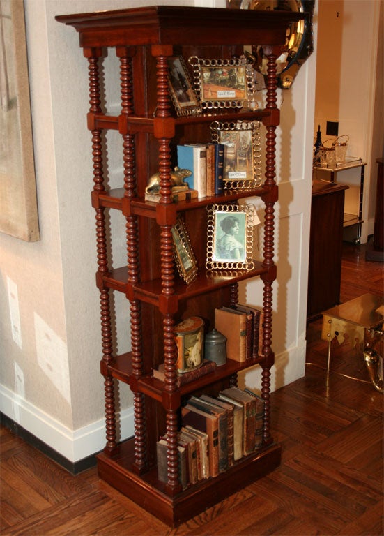 Unusual William IV Bobbin-Turned Double-Sided Mahogany Etagere/Bookcase,<br />
England, Mid 19th Century;  with Five Shelves on Each Side of a Mahogany Partition.  Each shelf: 20 inches x 7 inches.<br />
<br />
Note: This highly atypical