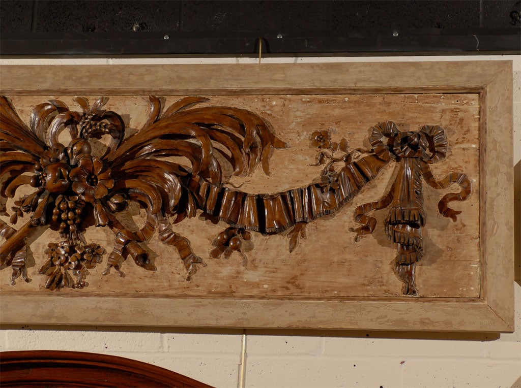 Early 20th Century Carved Walnut Overdoor with Plumes & Fruit by 