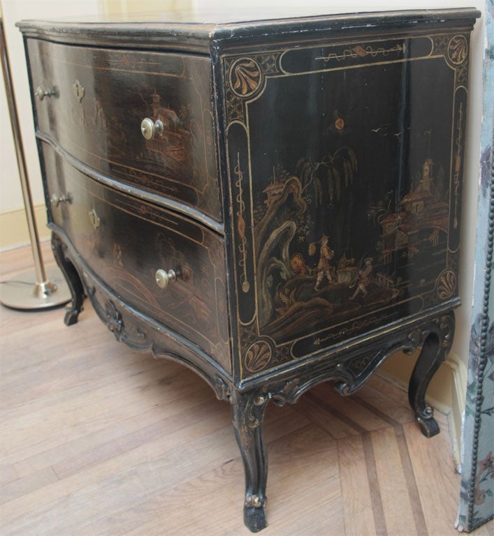 A painted, gilded and lacquered wood chest-of-drawers 1