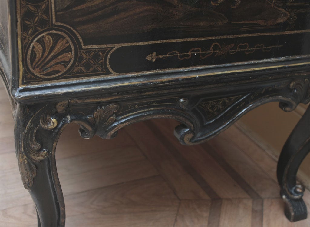 A painted, gilded and lacquered wood chest-of-drawers 2