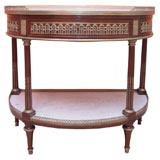 A mahogany, gilded bronze and white marble demi-lune console