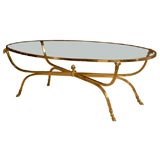 MID CENTURY OVAL GLASS COFFEE TABLE IN THE STYLE OF JANSEN