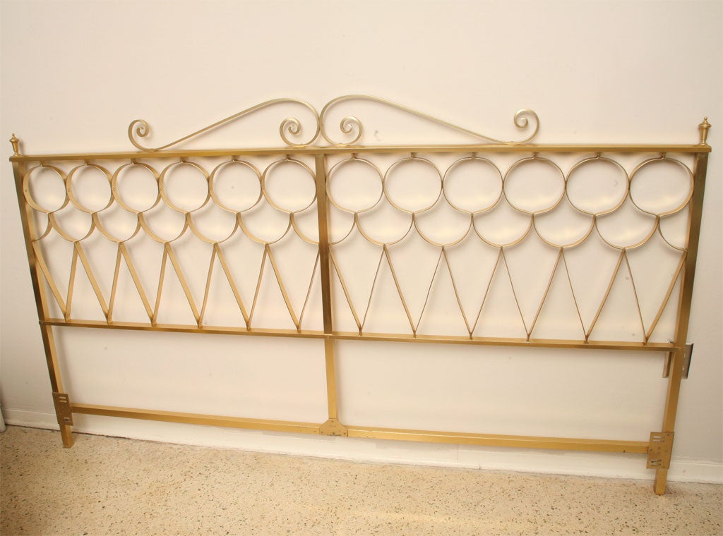 Words can't describe how this swank 60's king-sized headboard makes us swoon. Gold anodized aluminum, Parzinger-style grillwork, and urn finials capping the ends...heart be still!