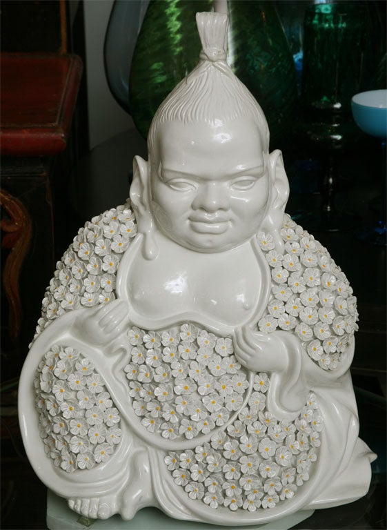 Some things defy reason...and we love them for it! This 70's, white Italian Buddha lamp is one of them. With a face only a mother could love, this breast-baring, big-earred Buddha is totally redeemed by his adorable daisy-encrusted robes. Cheeky and