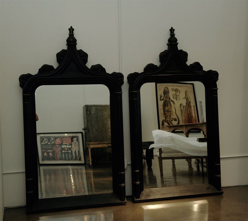 pair of two black wood framed mirrors picked up in Paris