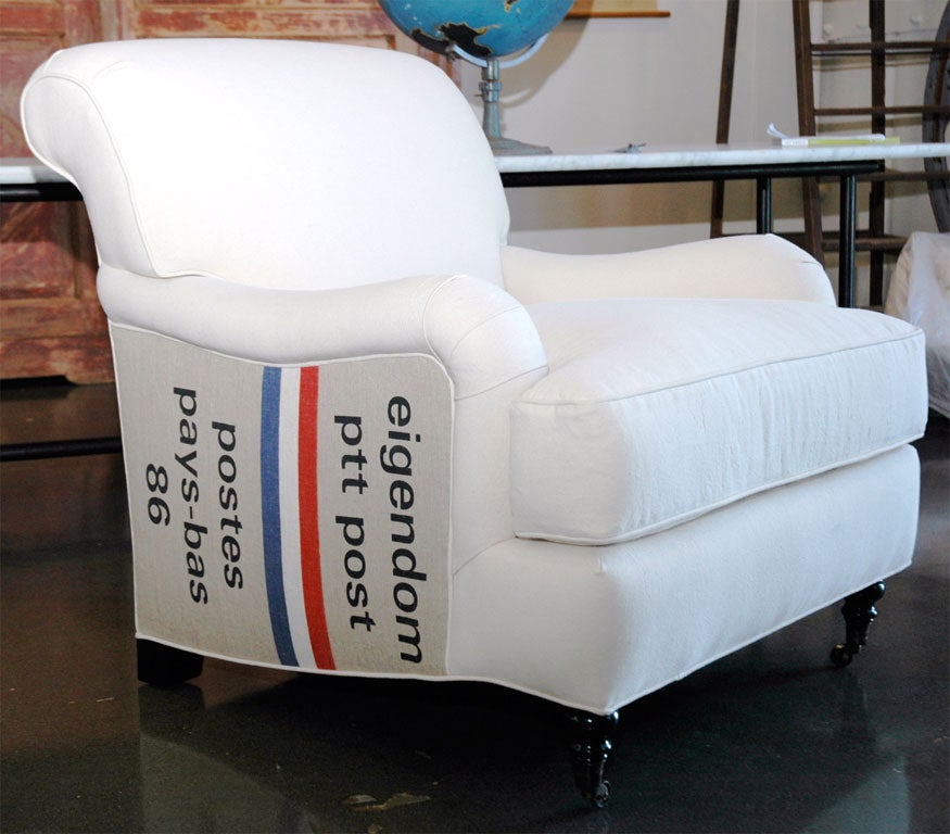 english arm club chair with vintage postal bags.