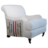 english arm club chair with vintage postal bags.