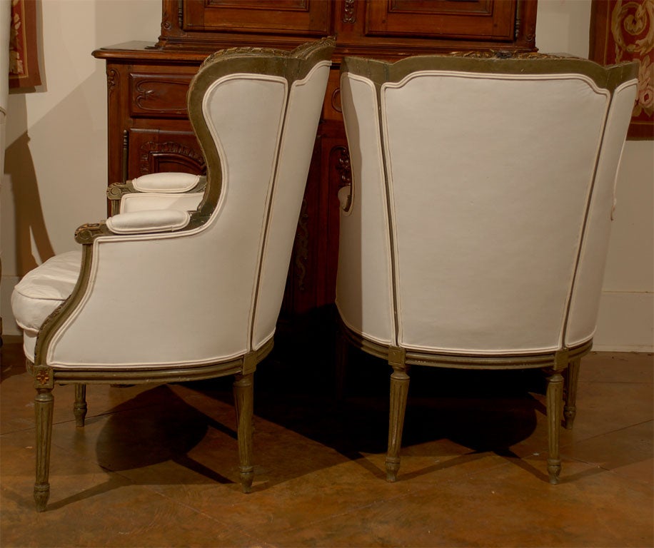 Pair of French Louis XVI Style 19th Century Painted Wingback Bergères Chairs In Good Condition In Atlanta, GA