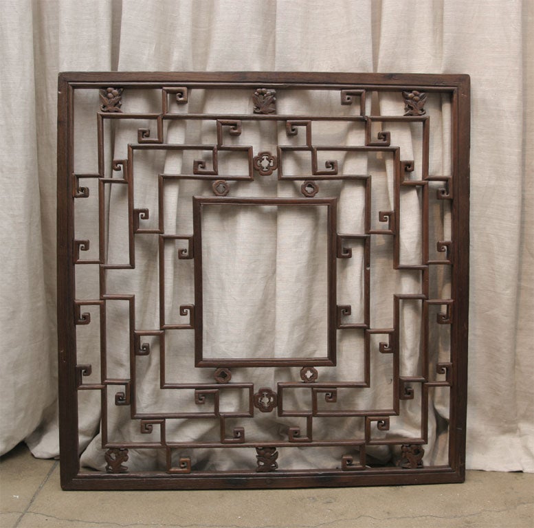 A mirrored cypress wood window screen with open fretworks, from Suzchou China, mid 19th Century. Mirrored (not shown). Sold separately.