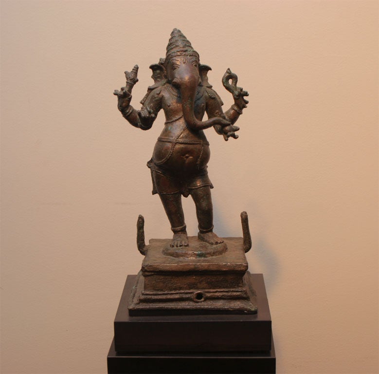 Small, finely wrought bronze Ganesha in standing in tribhanga pose.
