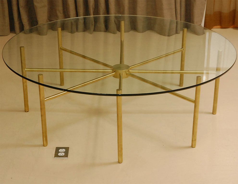 Brass radial coffee table with glass top.  Base is solid brass tube but is also available to order in a custom size or in a bronze or chrome plated finish.