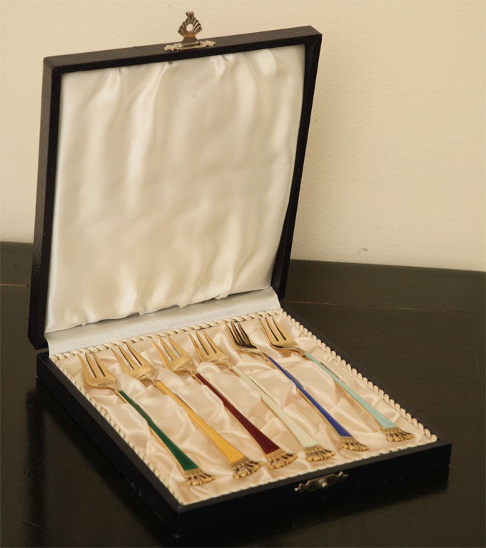 This lovely set of six cocktail forks are in their original box with satin lining. Hand made in sterling with a gold wash and luscious colored enamel inlay. Crowned tips add even more elegance. Jewel toned color's are Emerald, Citrine, Ruby, Pearl,