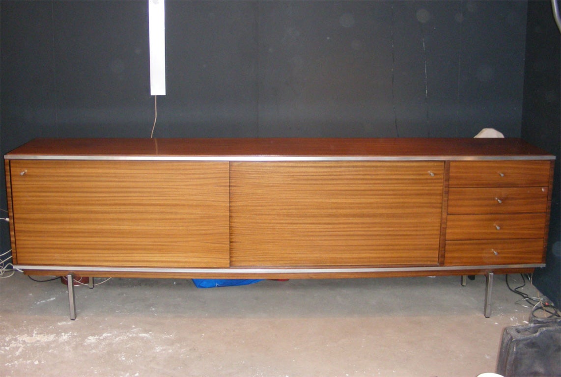 1962-1965 large sideboard- dresser by Pieter de Bruyne in veined teak and brushed steel. Two sliding doors and four drawers.
