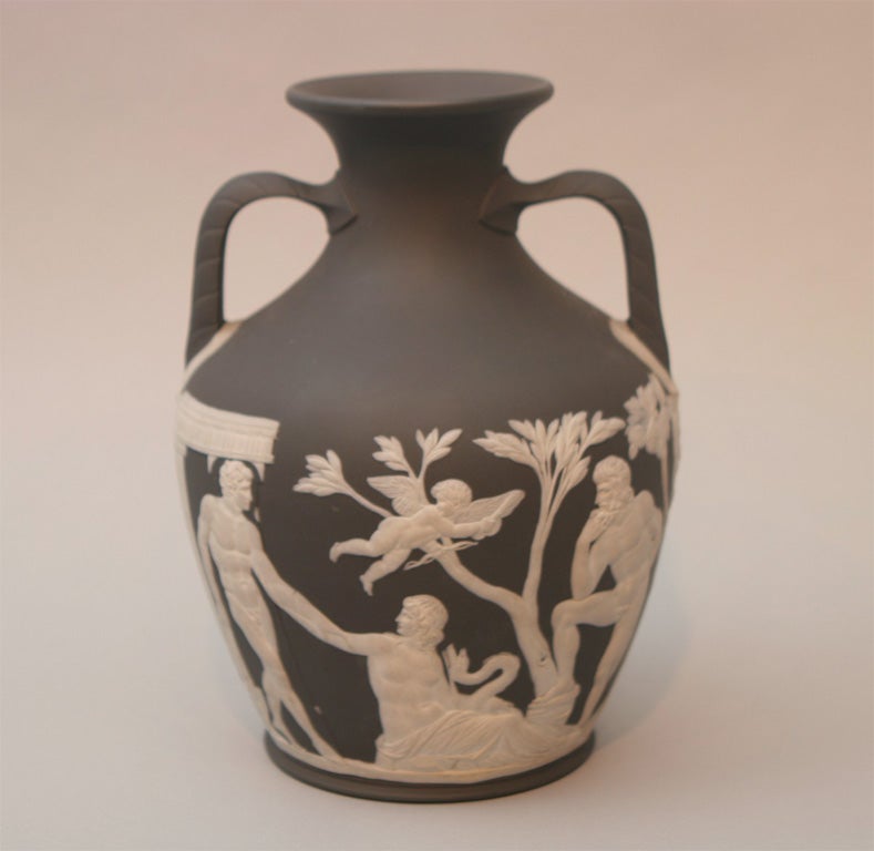 a fine Wedgwood black and white jasper Portland vase, the classical figures going all around the body and the base
