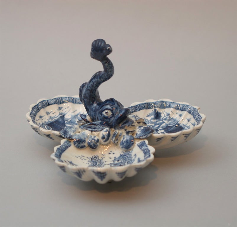 Bow porcelain blue and white sweetmeat dish with three shell sections and modeled dolphin center