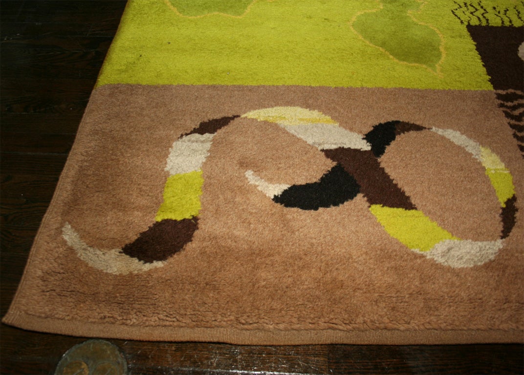 Handmade wool carpet, green and brown geometric designs, signed on back, by Lurcat for Maison Myrbor, French, late 1940's<br />
192 x 169 (cm)