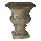Grouping of small limestone garden elements and bronze finials