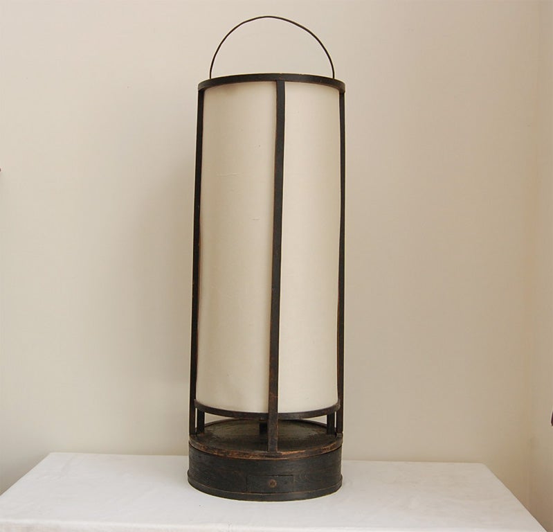 Andon is a lantern traditionally used inside a Japanese house. It has a wooden frame covered with Washi paper, and slides to open. An electric bulb attachment comes with it.