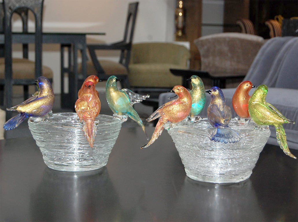 Beautiful pair of murano nest bowls which each have five stunning bird figurines that are perched on each edge.