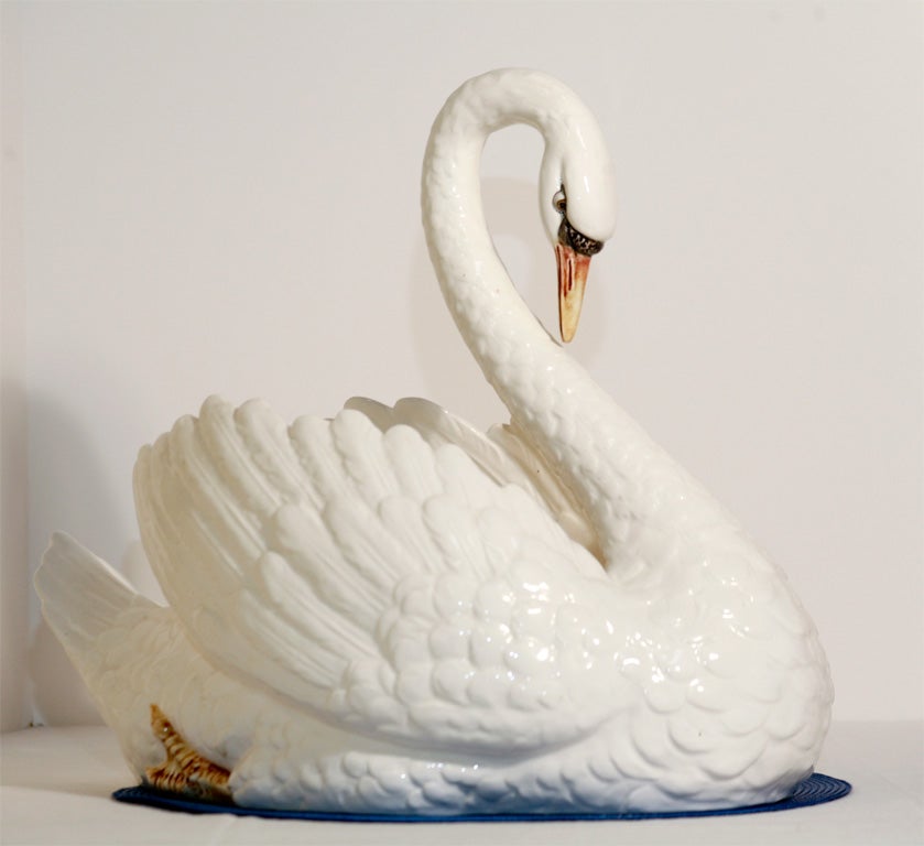 Wonderful large full figural swan centerpiece. This graceful bird can be filled with flowers, fruit or a plant. It is unmarked except with impressed numbers; attibuted to Italian manufacture.