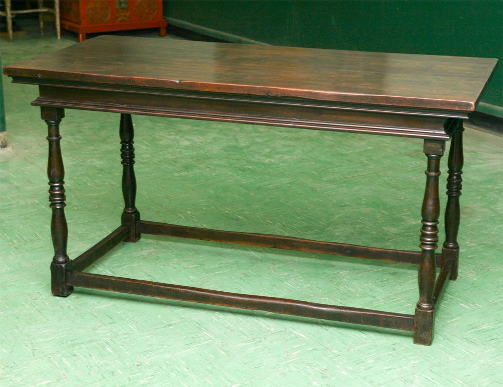 This very nice walnut table made in an old English design but very common also in the colonial period in America.  It. is small  as a dinning table but can be used as a  consol table or center table. The piece is  from the colonial revival period in