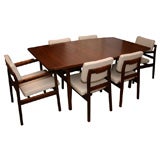 Jens Risom walnut dining table with 2 leaves and 6 chairs