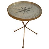 A Brass and Glass Compass Gueridon, attributed to Adnet.