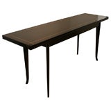 A Robsjohn-Gibbings Console Table.