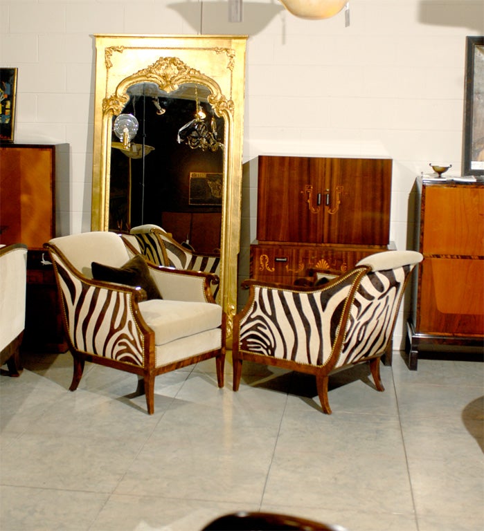 Extraordinary pair of restored vintage Empire Revival arm chairs.  Crafted in dark flame birch and newly upholstered in deep ecru mohair fabric on the interior and chocolate brown zebra print hair cowhide on the exterior - over sturdy hardwood