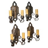 Four Iron sconces signed "Lincoln"