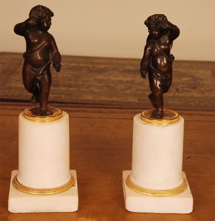 Pair of Louis XVI Gilt and Patinated Bronze Figures of Putti