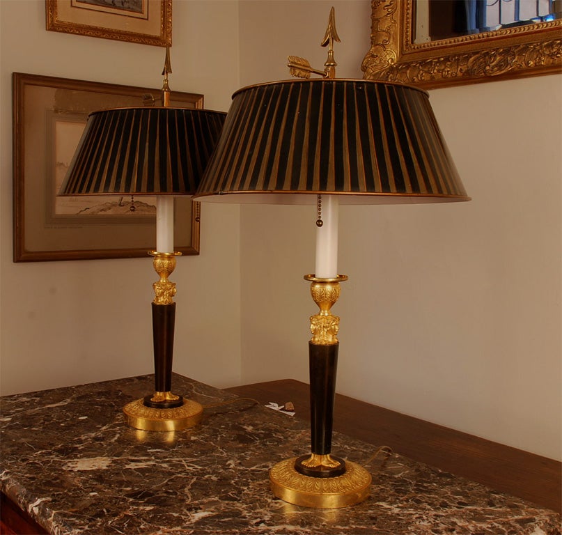 Pair of Consulat Gilt and Patinated Bronze Figural Candlesticks