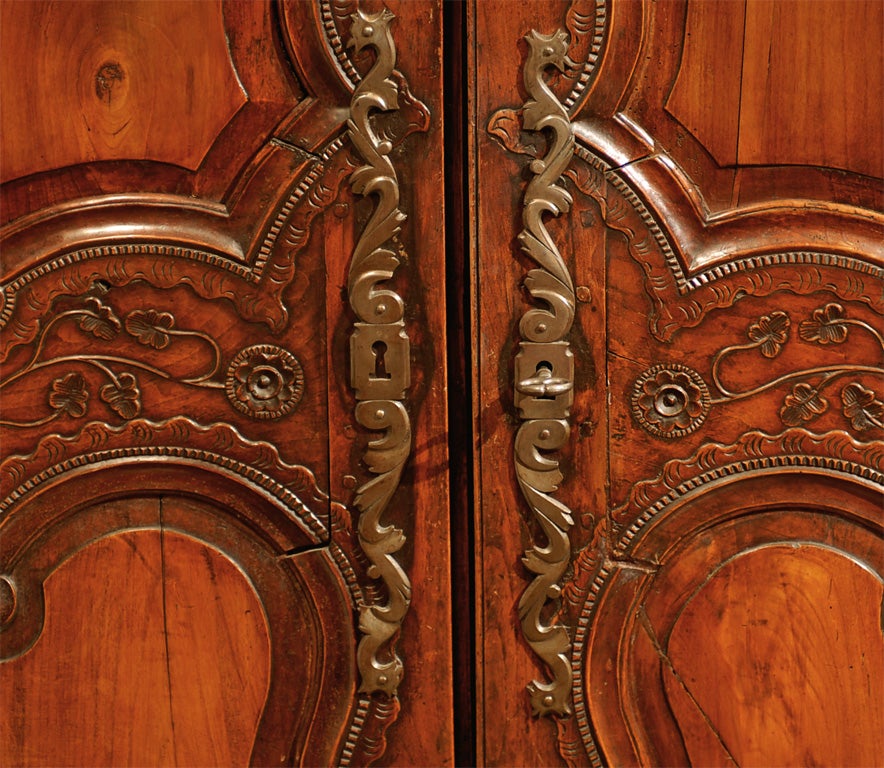 French Late 18th Century Cherry Armoire from Rennes with Hand Carved Décor In Good Condition For Sale In Atlanta, GA