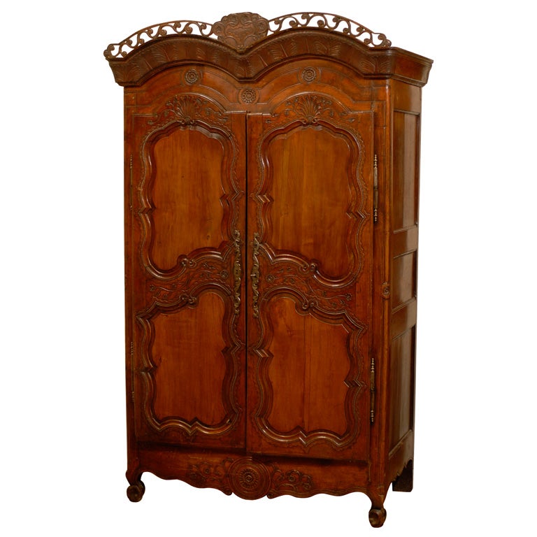 French Late 18th Century Cherry Armoire from Rennes with Hand Carved Décor For Sale