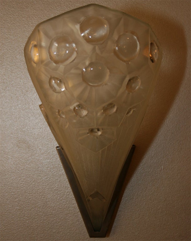 Exceptional Art Deco frosted and clear floral motif molded glass sconce in a satin nickel signed by Muller Frères.