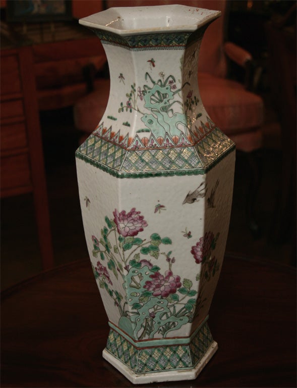 Chinese octagonal shaped vase Ca. 1880 with beautiful colors and degign.